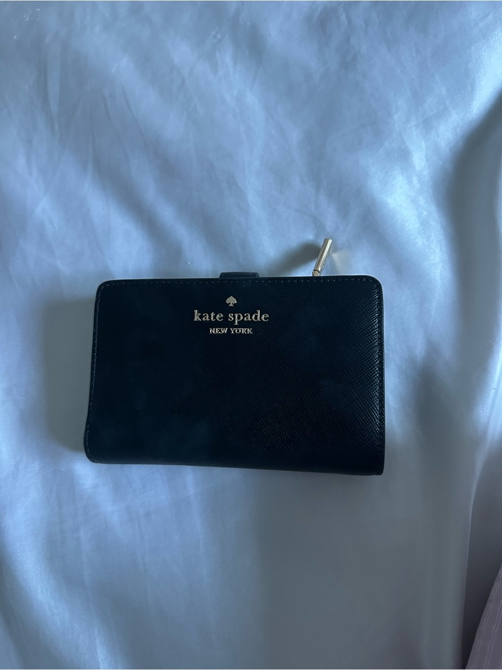 kate spade black zip-around Saffiano leather wallet with gold logo